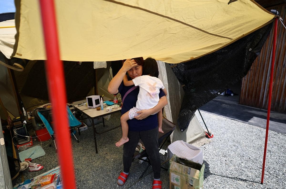Japan Earthquake Survivors Struggle with Water Shortages and Heat as Death Toll Reaches 25